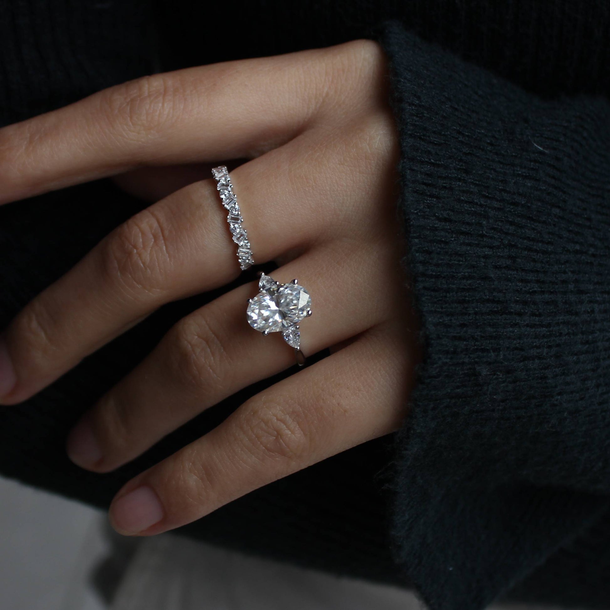 Moissanite pavé stacking ring set worn on hand, lifestyle photo