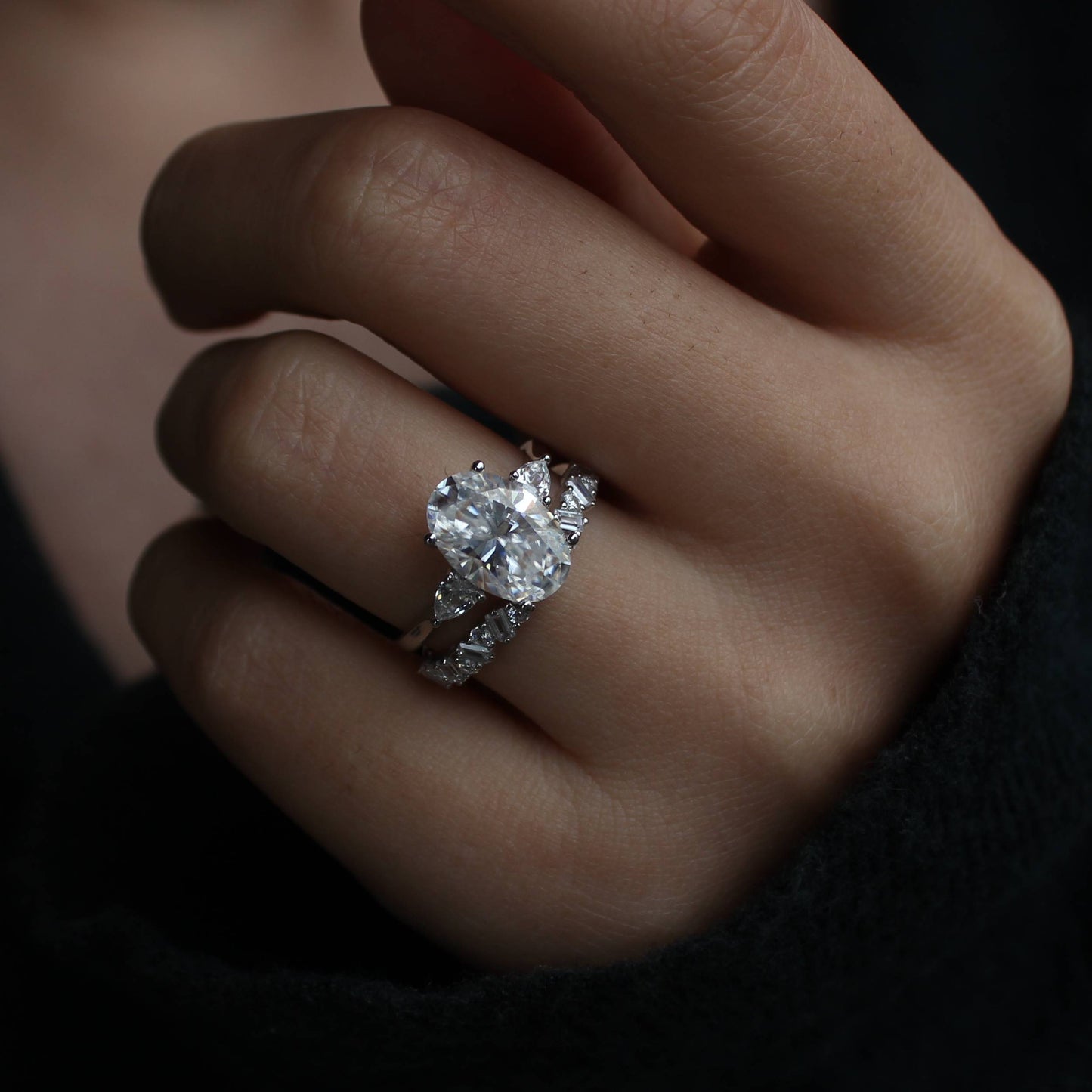 Oval moissanite duo rings layered look on finger