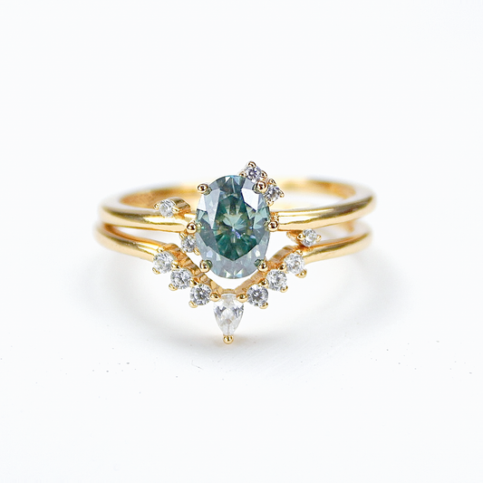 Oval moissanite duo ring set in 18K gold plated sterling silver on white background