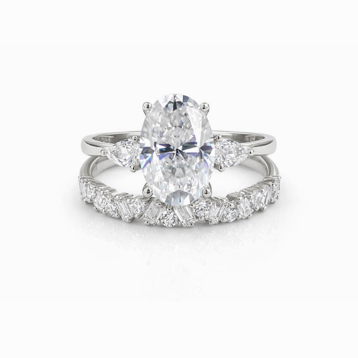 Oval moissanite duo rings stacked together, white gold tone