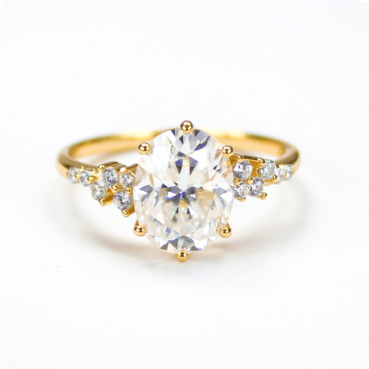 Oval moissanite solitaire ring in 18K gold plated sterling silver on white background