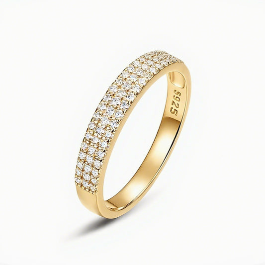 Pavé moissanite band ring in 18K gold plated sterling silver on white background
