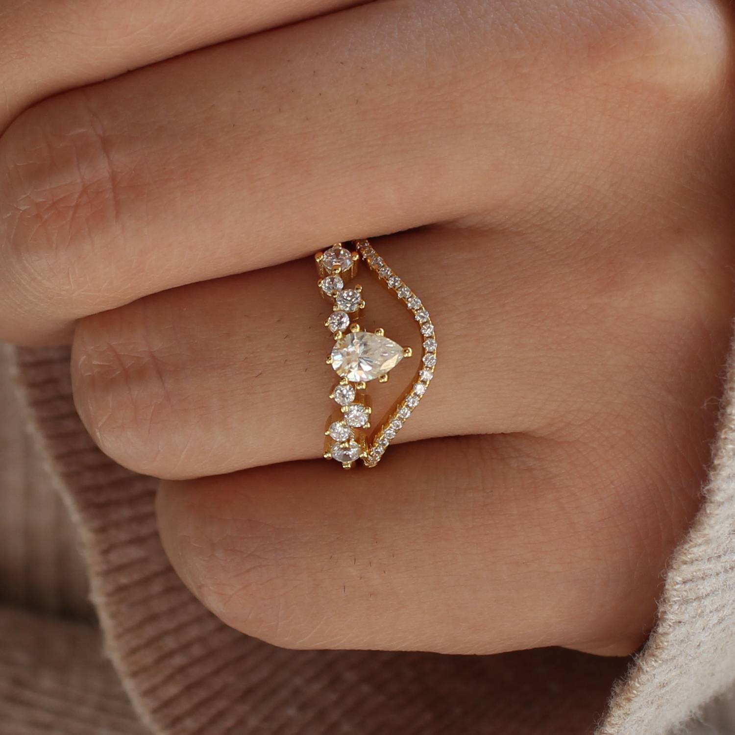 Moissanite curved band ring set worn on hand, close-up detail