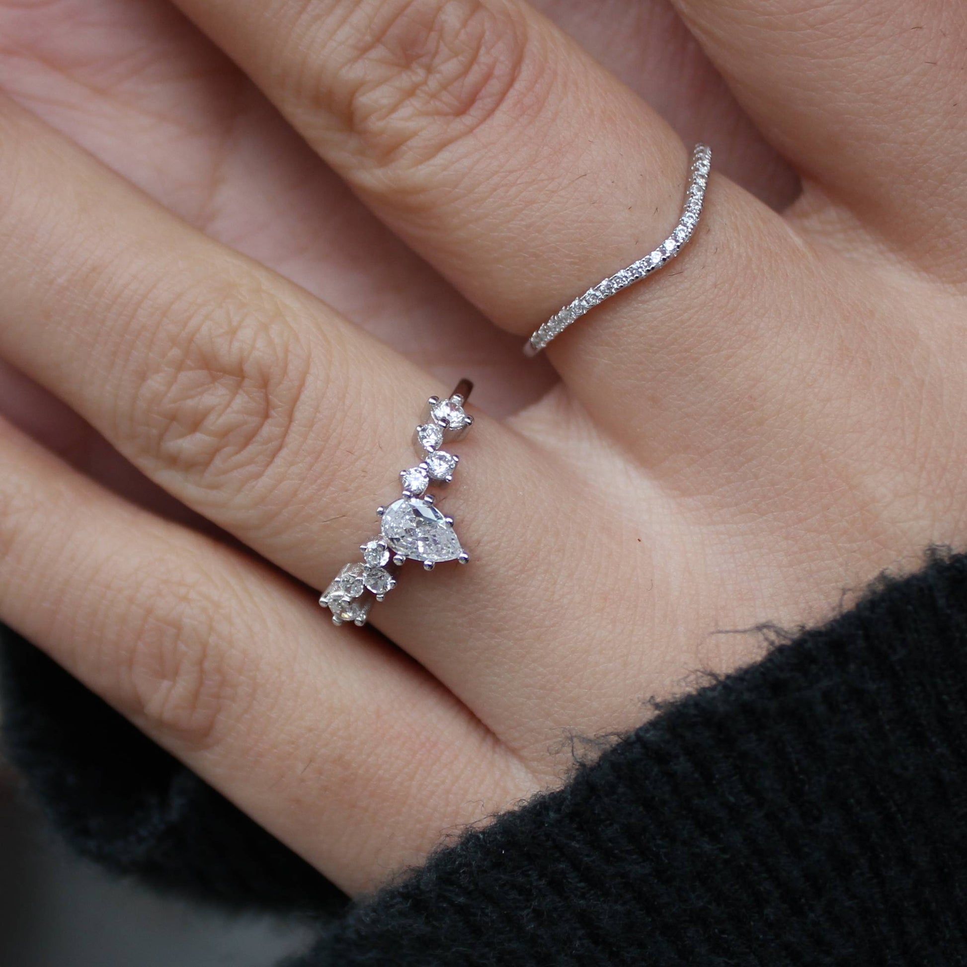 Petite Duo moissanite ring set worn with other stacking rings