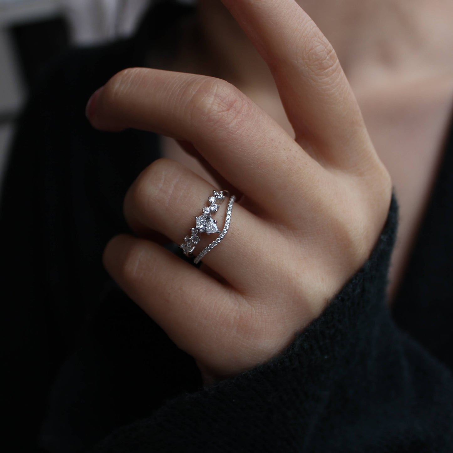 Moissanite stacking band rings worn on hand, lifestyle photo