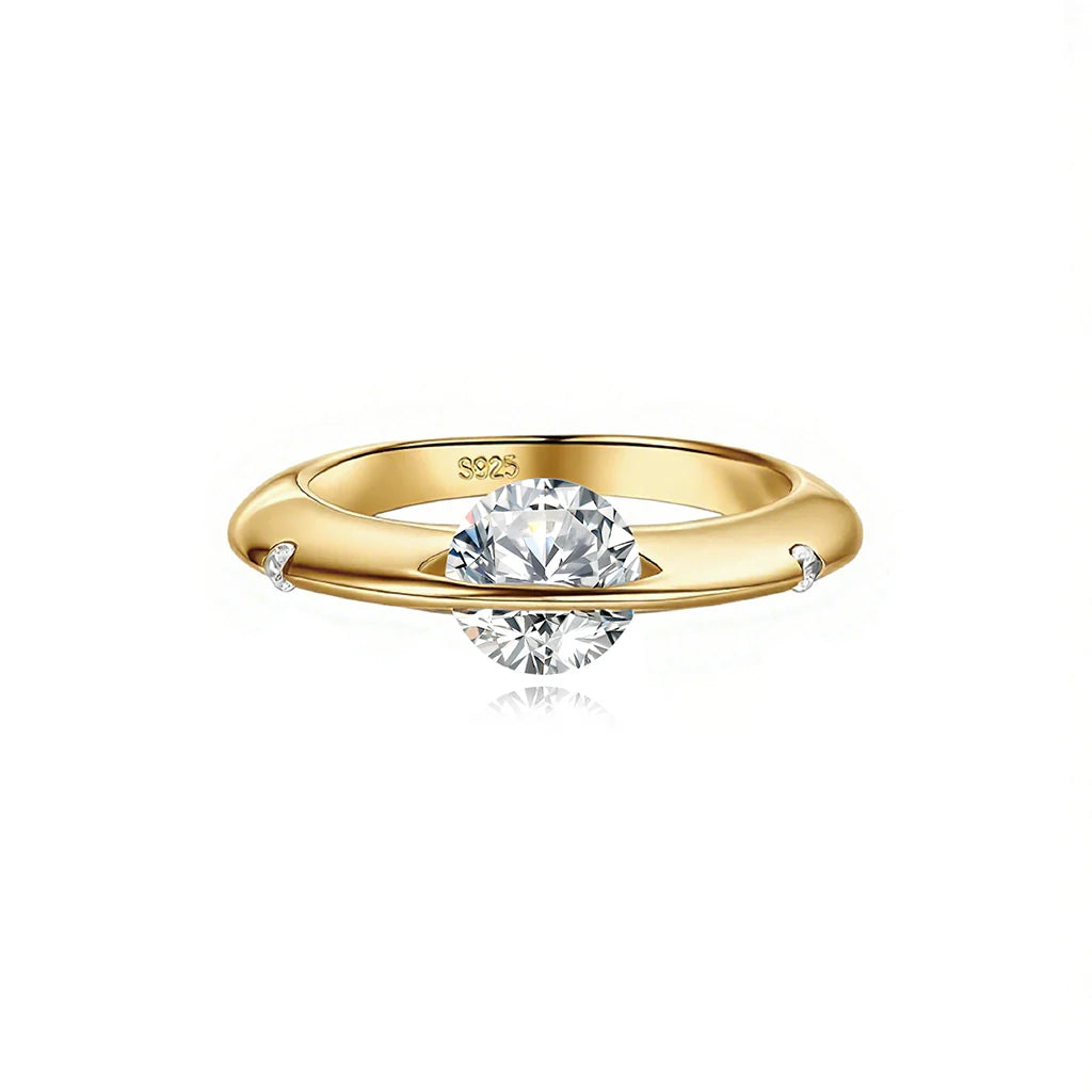 Front view of Stellar rotatable moissanite ring in gold tone on white background