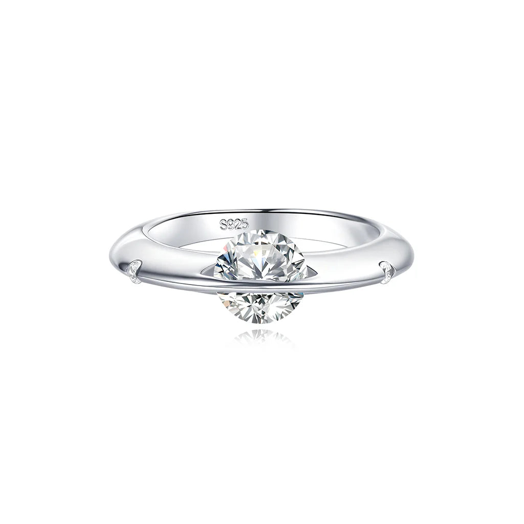 Front view of Stellar rotatable moissanite ring in white gold tone on white background