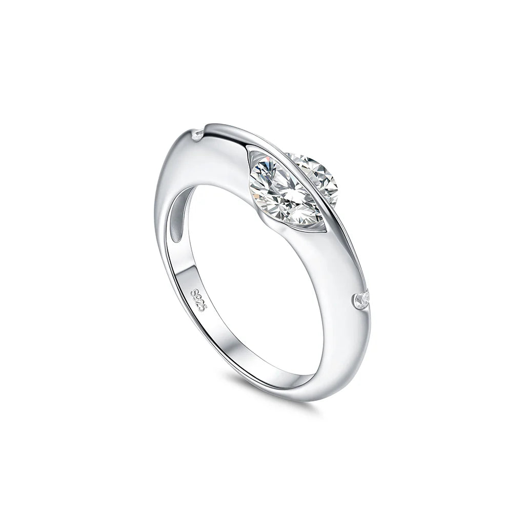 Stellar rotatable moissanite ring in white gold tone, vertical angled view on white background