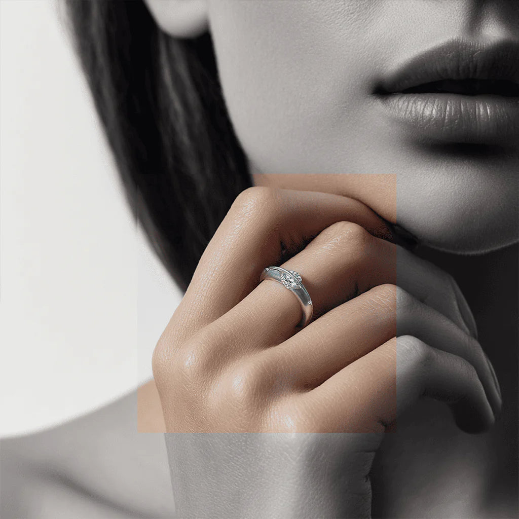 Stellar rotatable moissanite ring in white gold tone worn on hand, minimalist unisex style